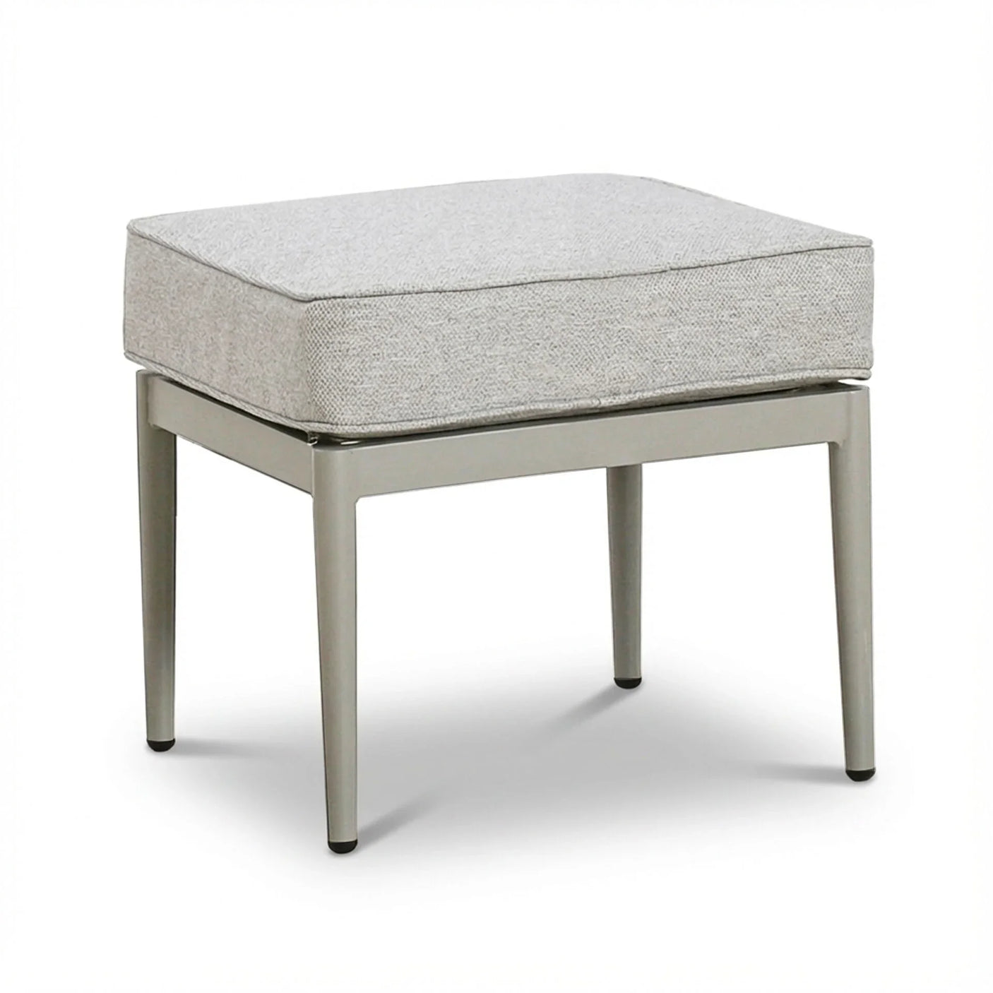 Modern ottoman with light grey cushion and metal legs on white background