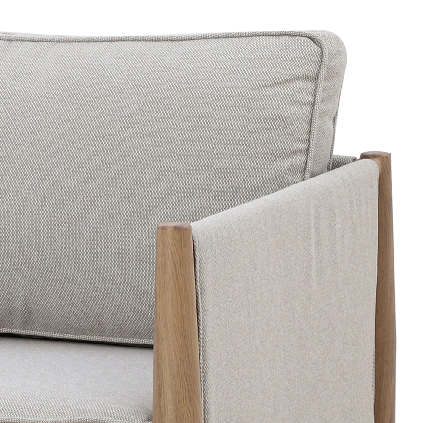 Beige fabric armchair with wooden frame and cushioned seat, close-up of arm and back