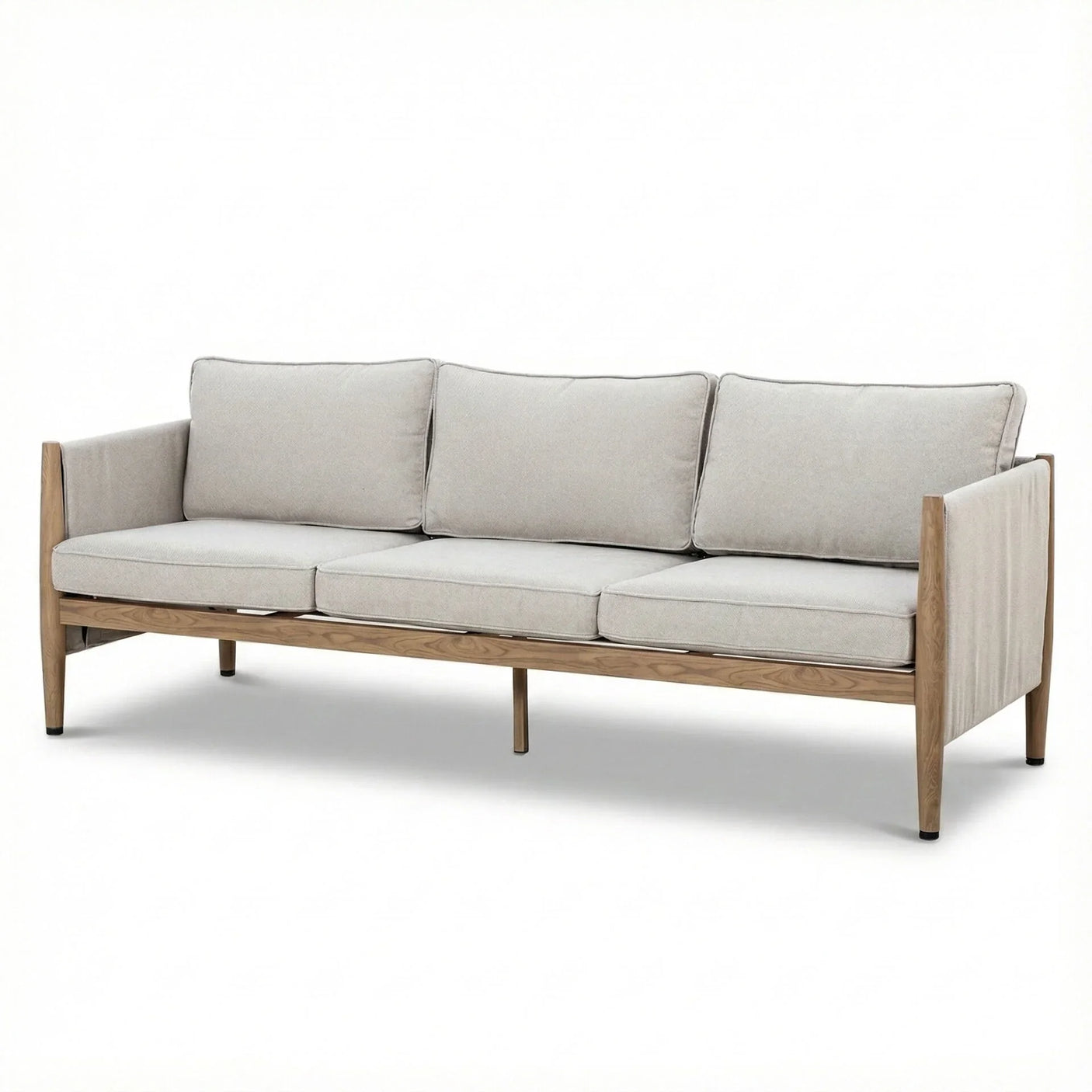 Three seater sofa with light grey cushions and exposed wood frame on white background