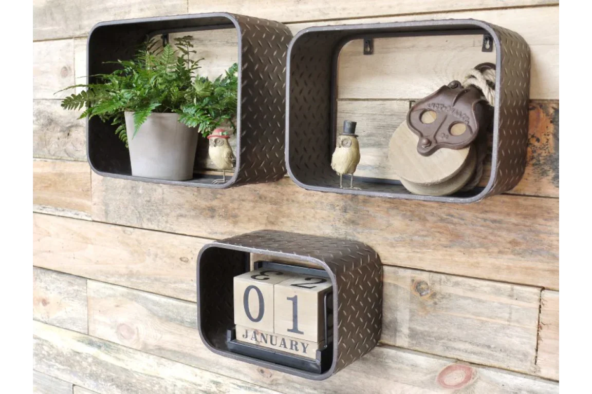 Industrial metal wall shelves with diamond plate pattern, displaying decor and wooden block calendar