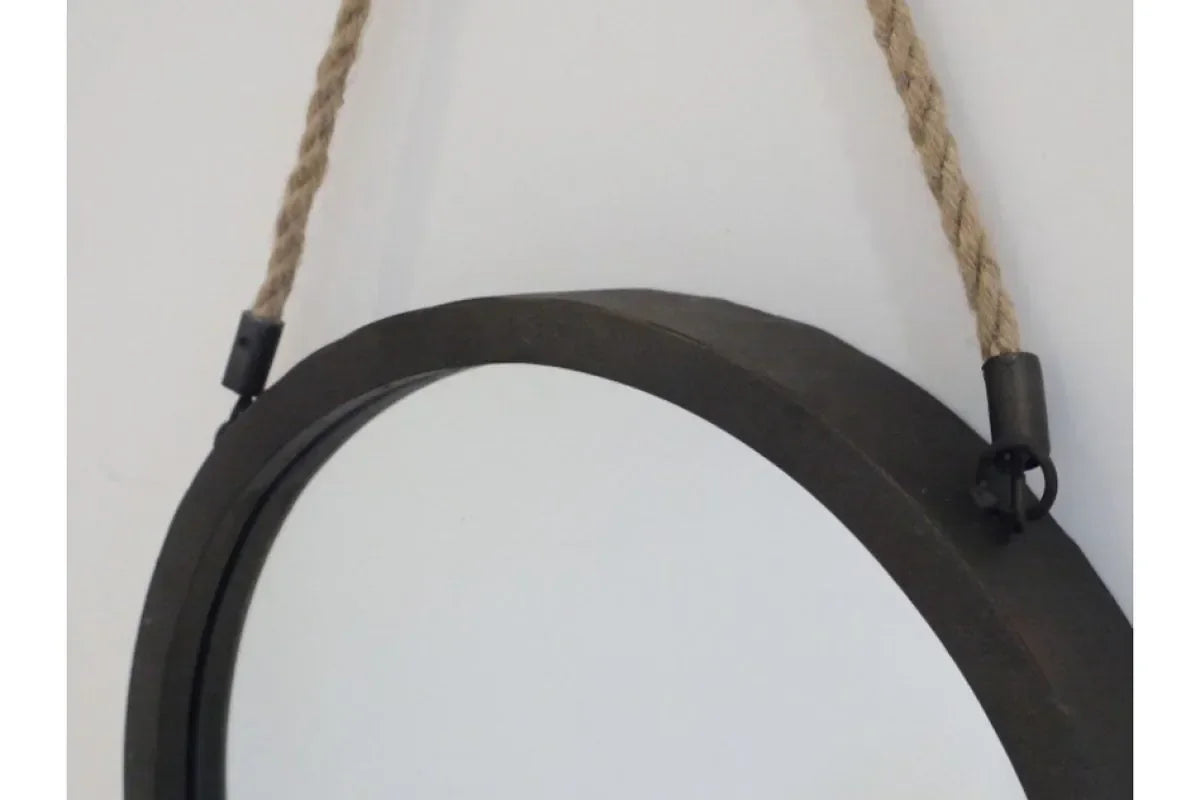 Round wall mirror with metal frame and hanging rope detail