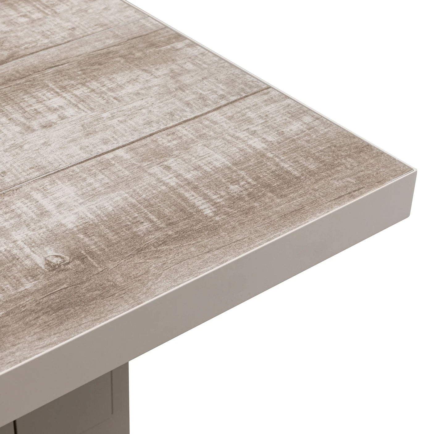 Close-up of light wood effect dining table corner with smooth beige frame
