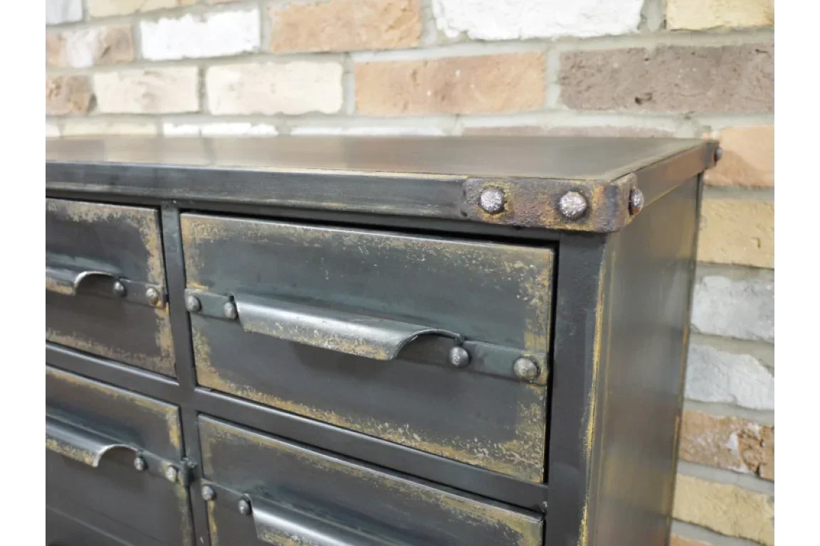 Industrial metal chest of drawers with distressed finish and rivet detail