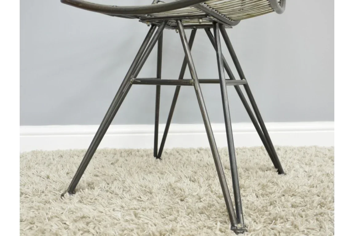 metal chair legs on beige shag rug with grey wall background