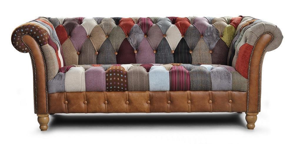 Patchwork fabric and tan leather chesterfield sofa with button tufting and rolled arms