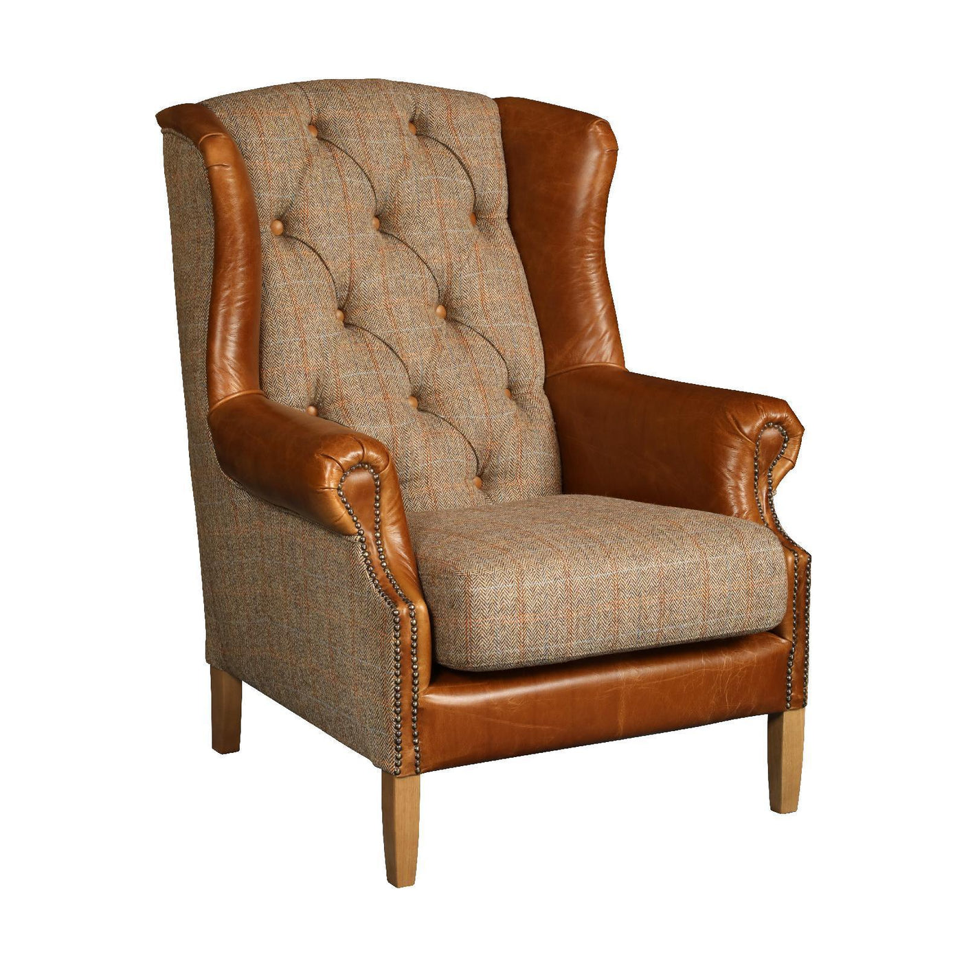 Wingback armchair with brown leather arms and plaid fabric upholstery, button-tufted backrest
