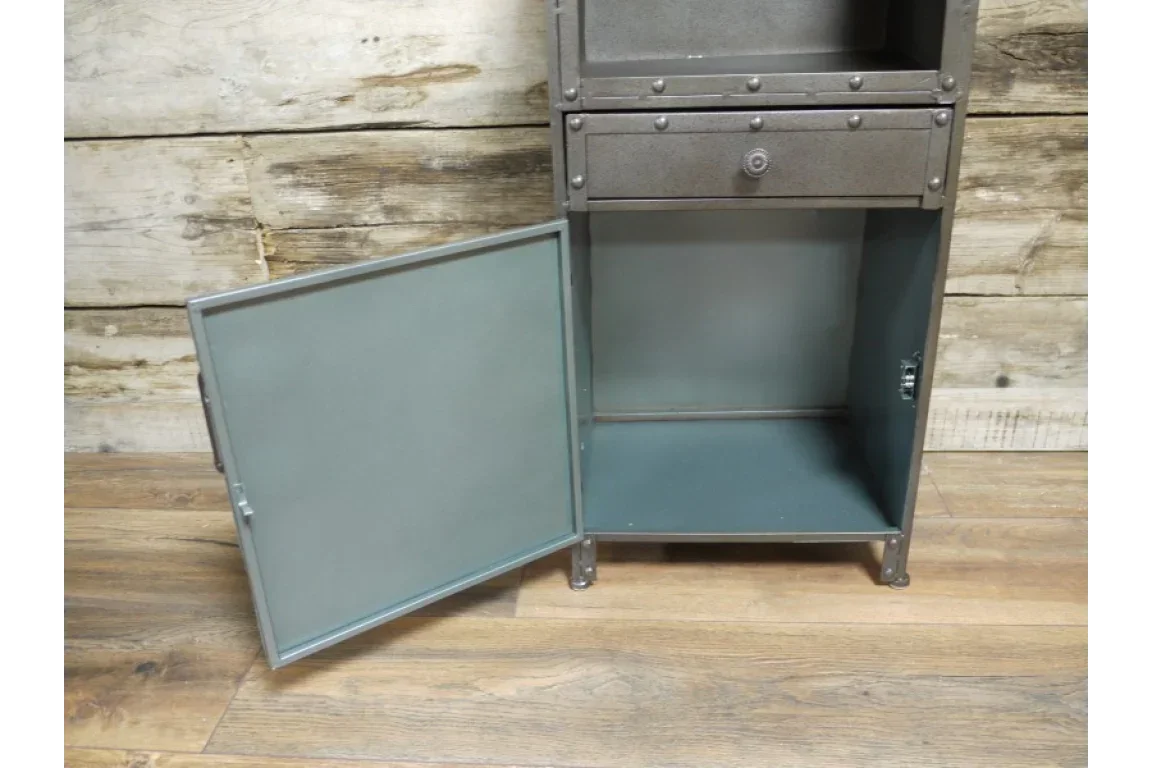 Industrial metal cabinet with open lower door, exposed storage compartment and wood floor