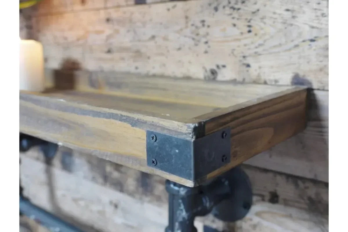 Industrial wood wall shelf with metal pipe brackets and black corner plates