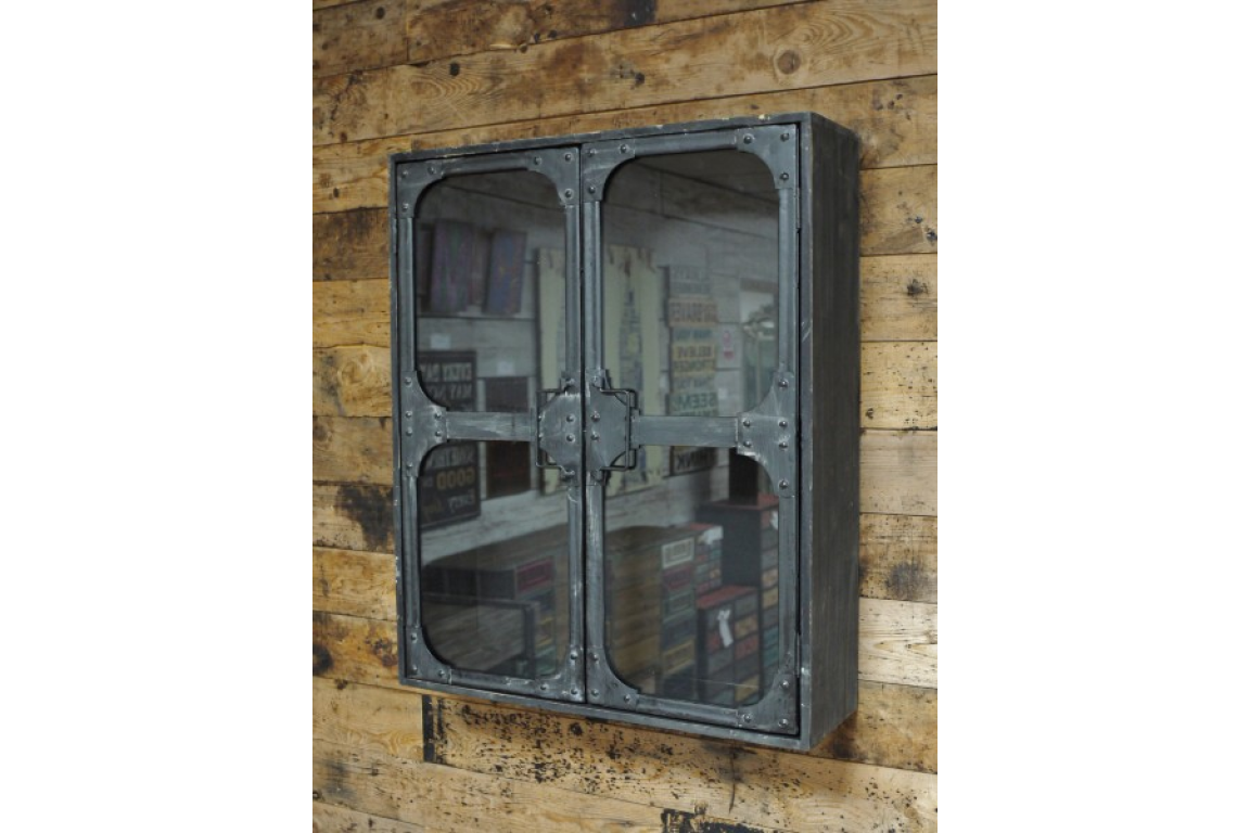 Wall-mounted black metal wall cabinet with two glass doors, viewed from a slight side angle against a wooden plank wall.