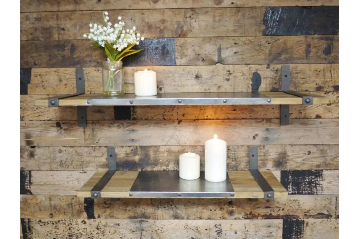Industrial wood and metal wall shelves with candles and glass vase against rustic background