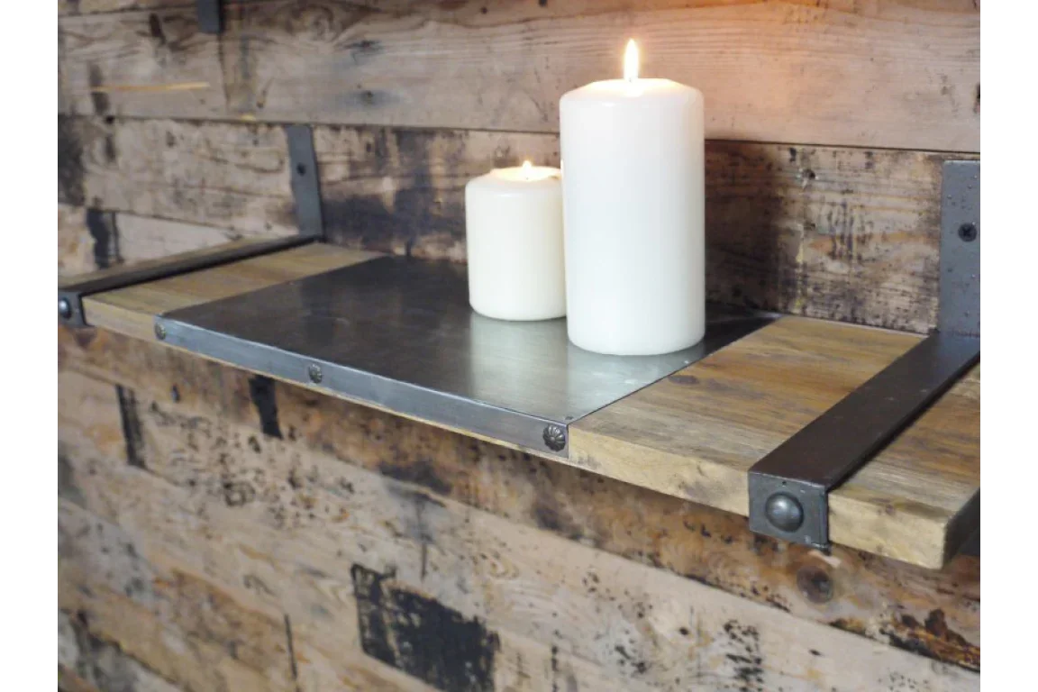 Industrial wood and metal wall shelf with two white pillar candles