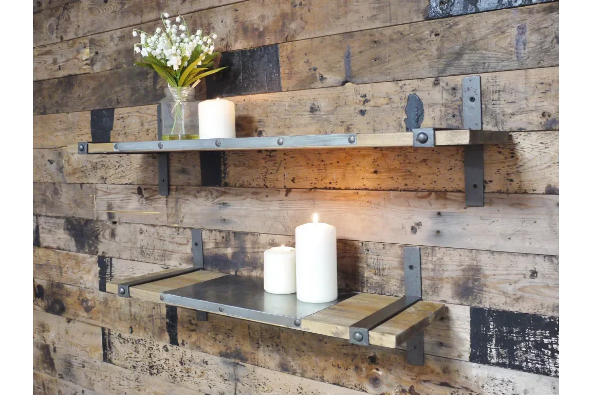 Industrial wood and metal wall shelves with candles and flowers against rustic wood panel