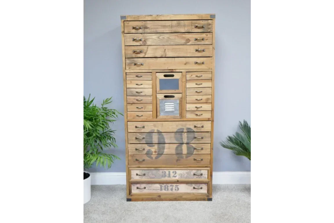 Tall wooden chest of drawers with numbered fronts and metal handles in a modern room