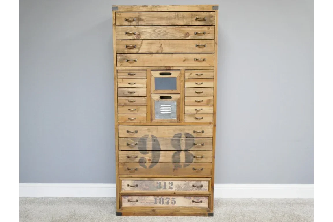 Tall wooden chest of drawers with metal handles and painted numbers in neutral room