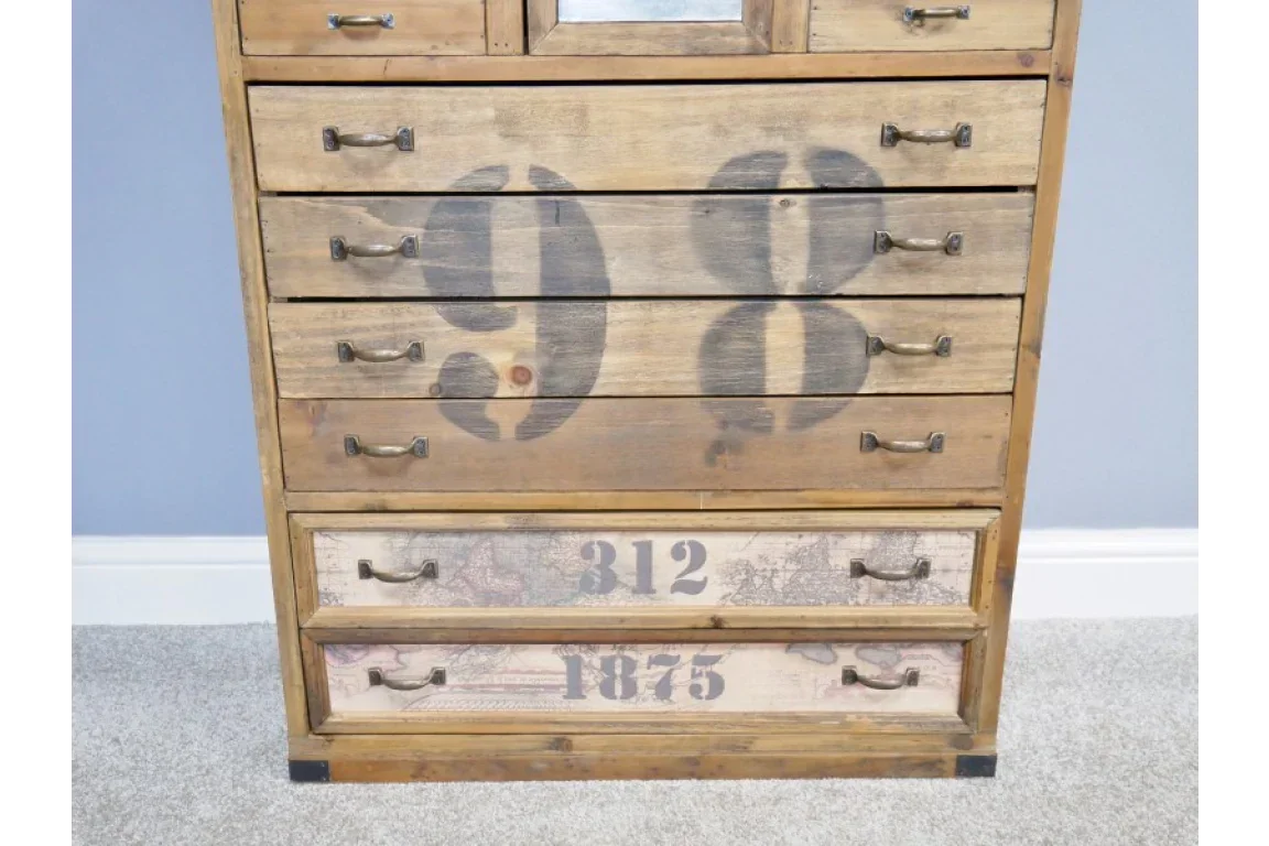 Rustic wooden chest of drawers with black numbers and vintage metal handles