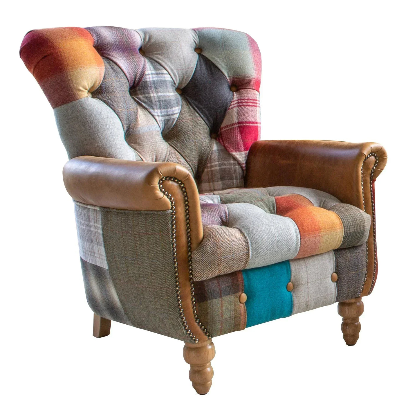 Patchwork armchair with checked fabric, brown leather arms and wooden legs, angled view