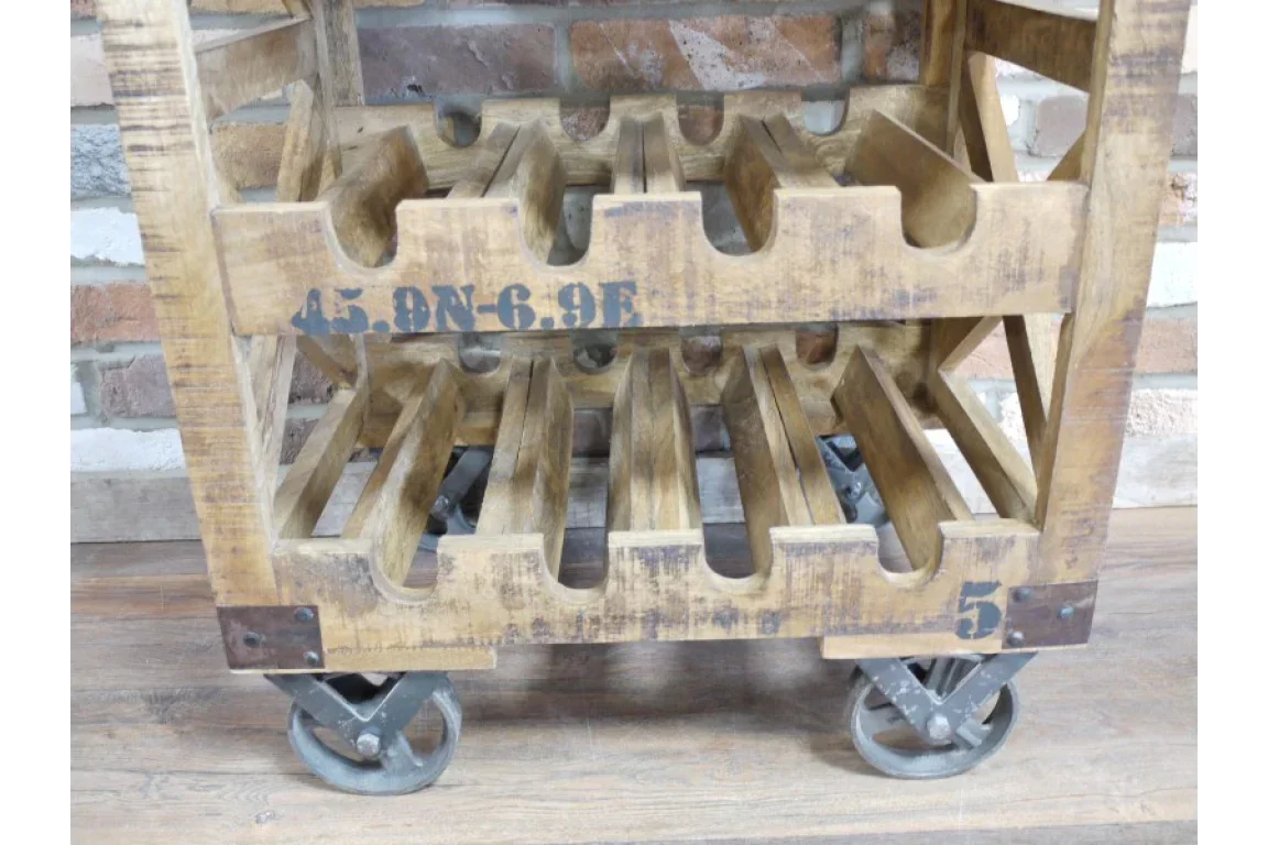 Industrial wooden wine rack with numbered slots and metal caster wheels on wooden floor