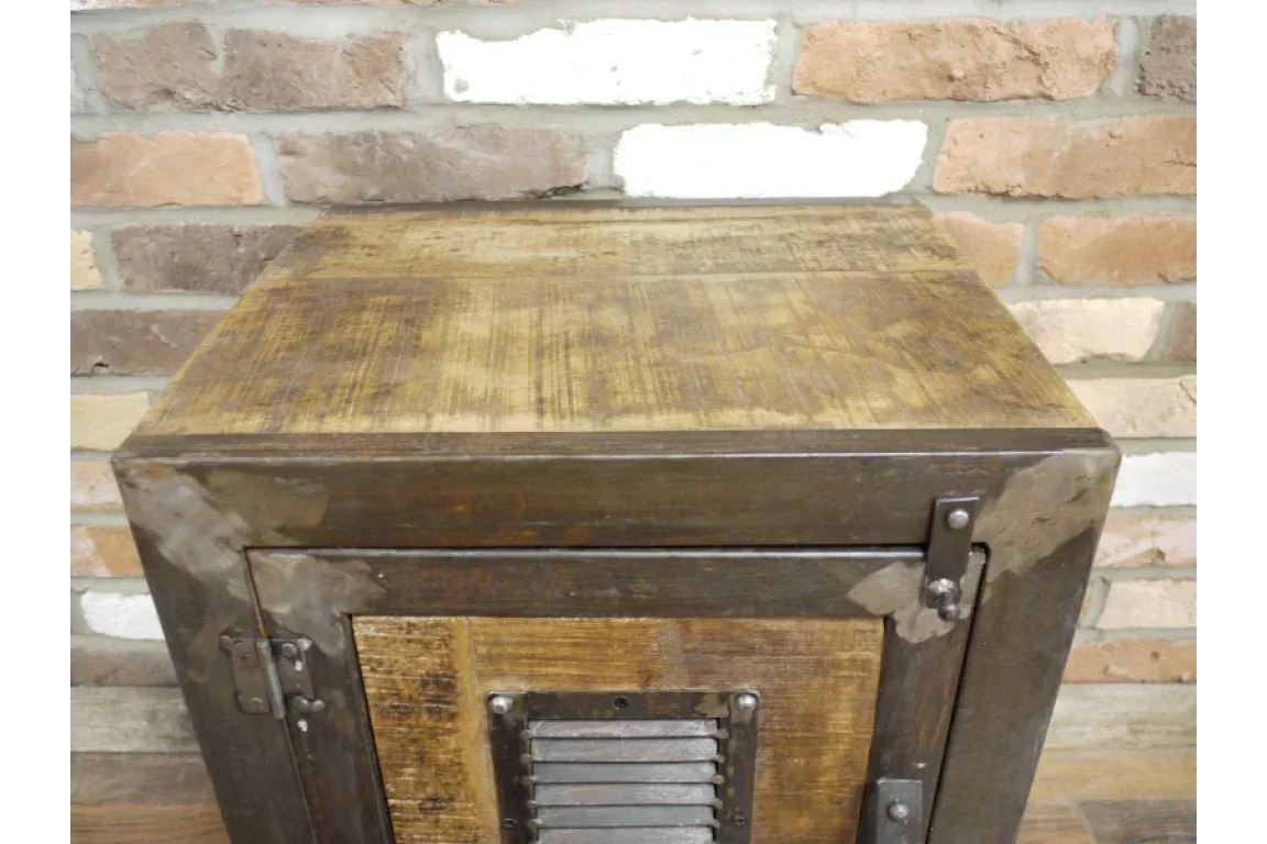 Industrial wooden bedside table with metal accents against brick wall