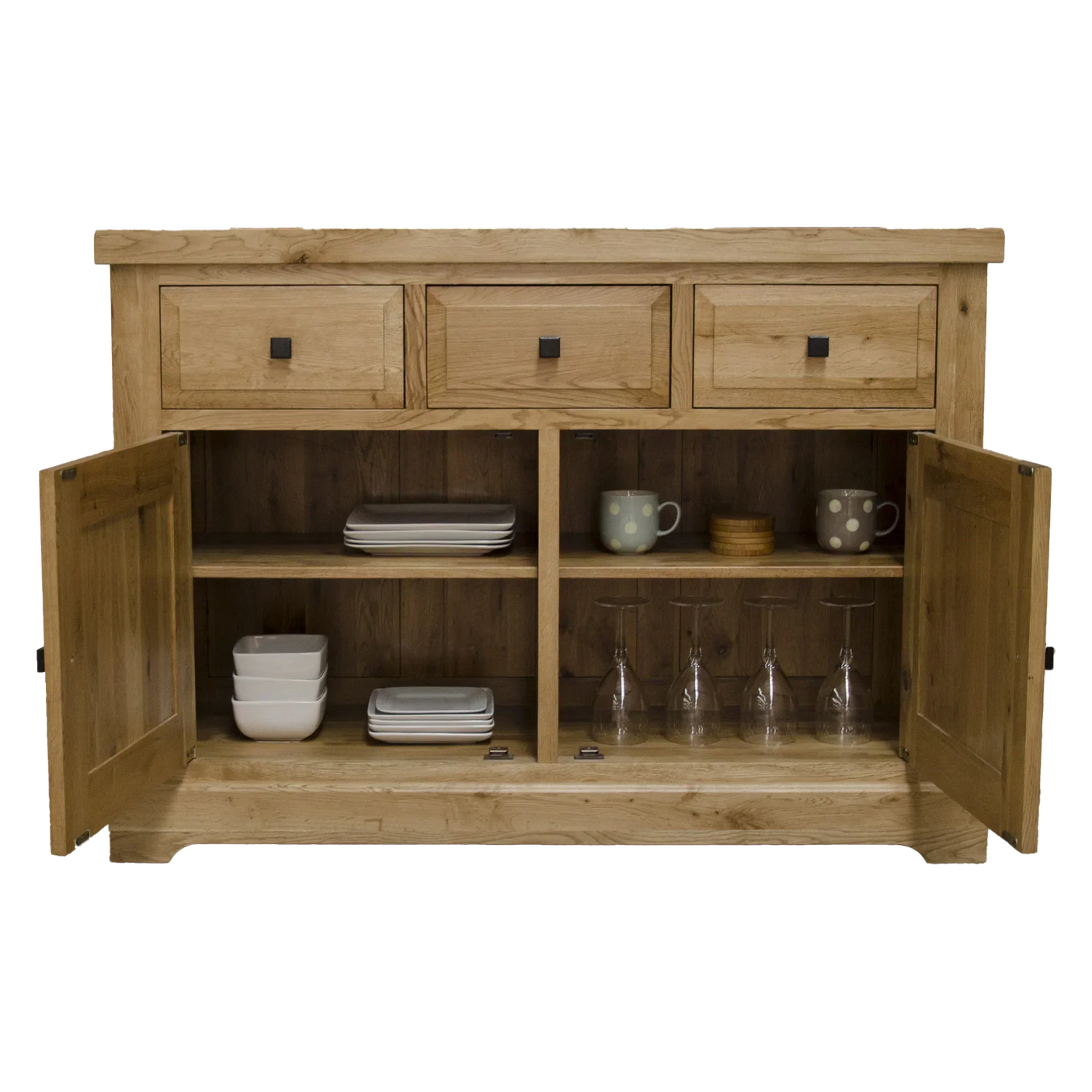 Oak sideboard with three drawers, open cupboard doors, shelves holding plates and glasses