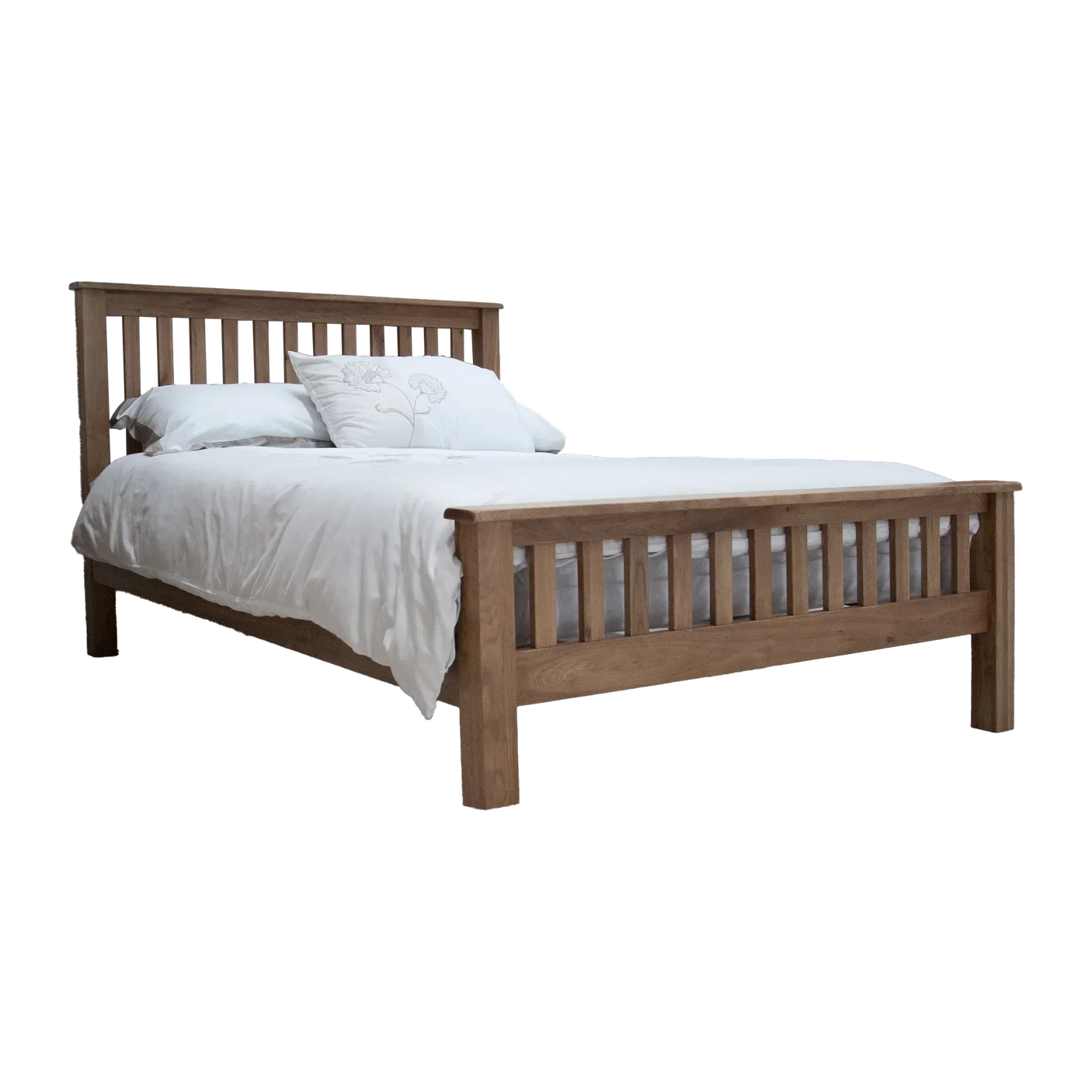 Oak wooden bed frame with slatted headboard and white bedding, side angle view