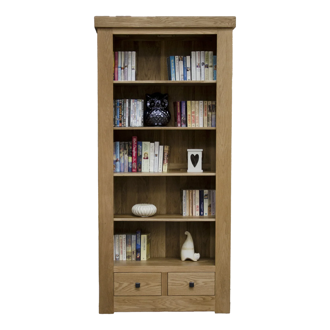 Oak bookcase with shelves filled with books, drawers at bottom, decorative accents displayed