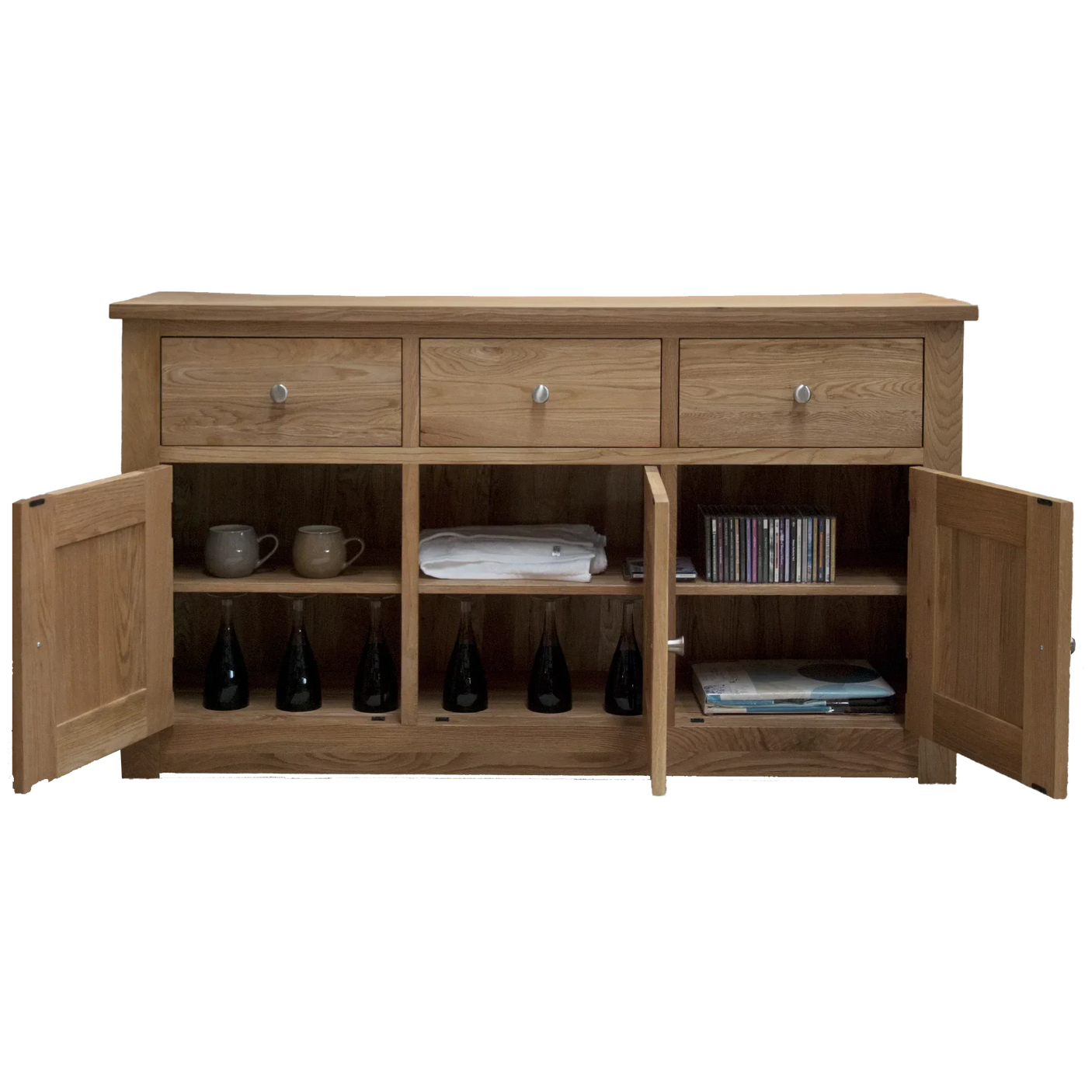 Solid oak sideboard with three drawers and open cupboard shelves displaying mugs and bottles