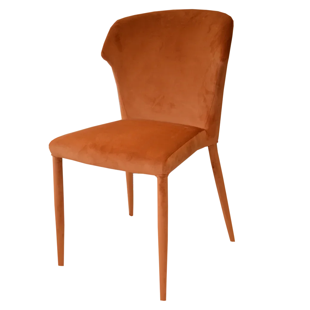 Rust velvet dining chair with cushioned seat and tapered legs, side angle view