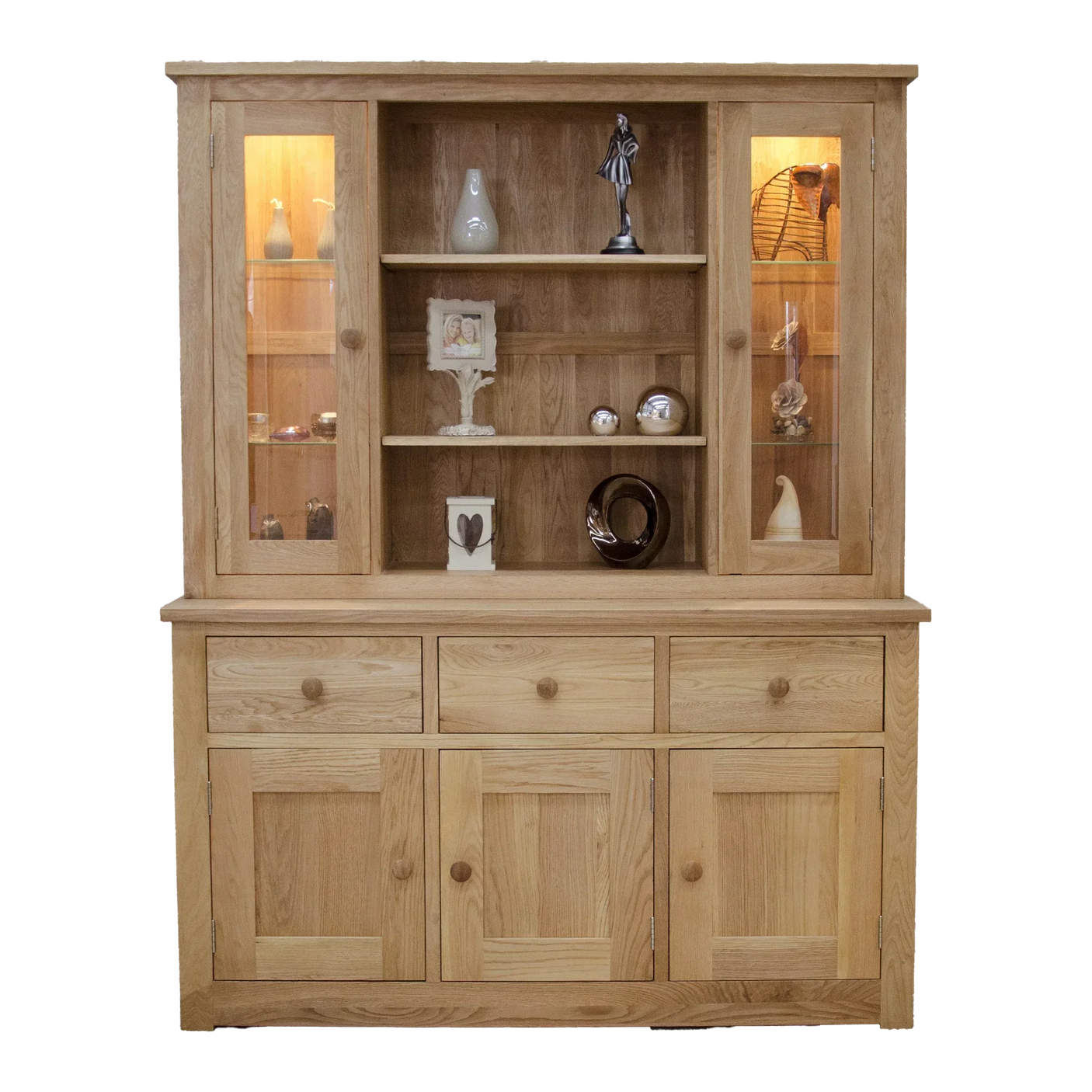 Oak display cabinet with glass doors, shelves, and lower storage drawers