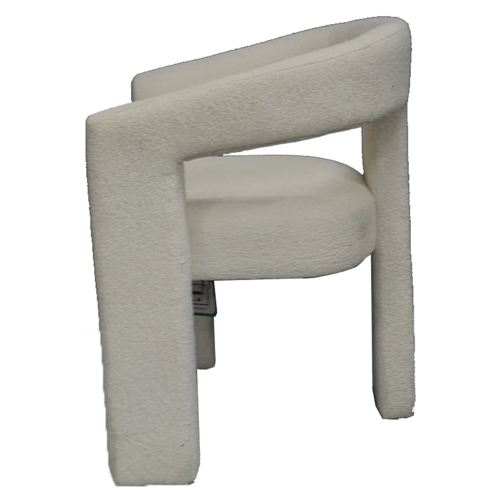 Modern cream accent chair with curved backrest and soft upholstery, side view