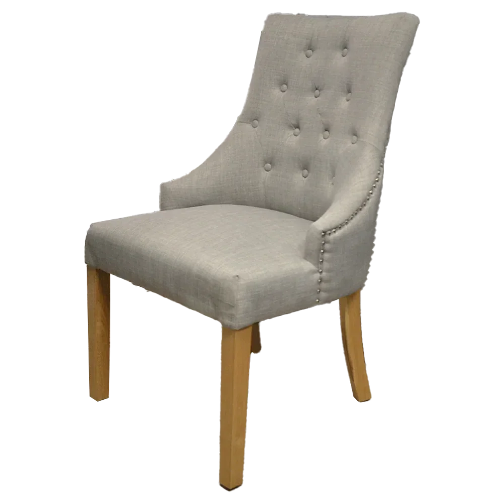 Light grey fabric dining chair with button tufted backrest and wooden legs