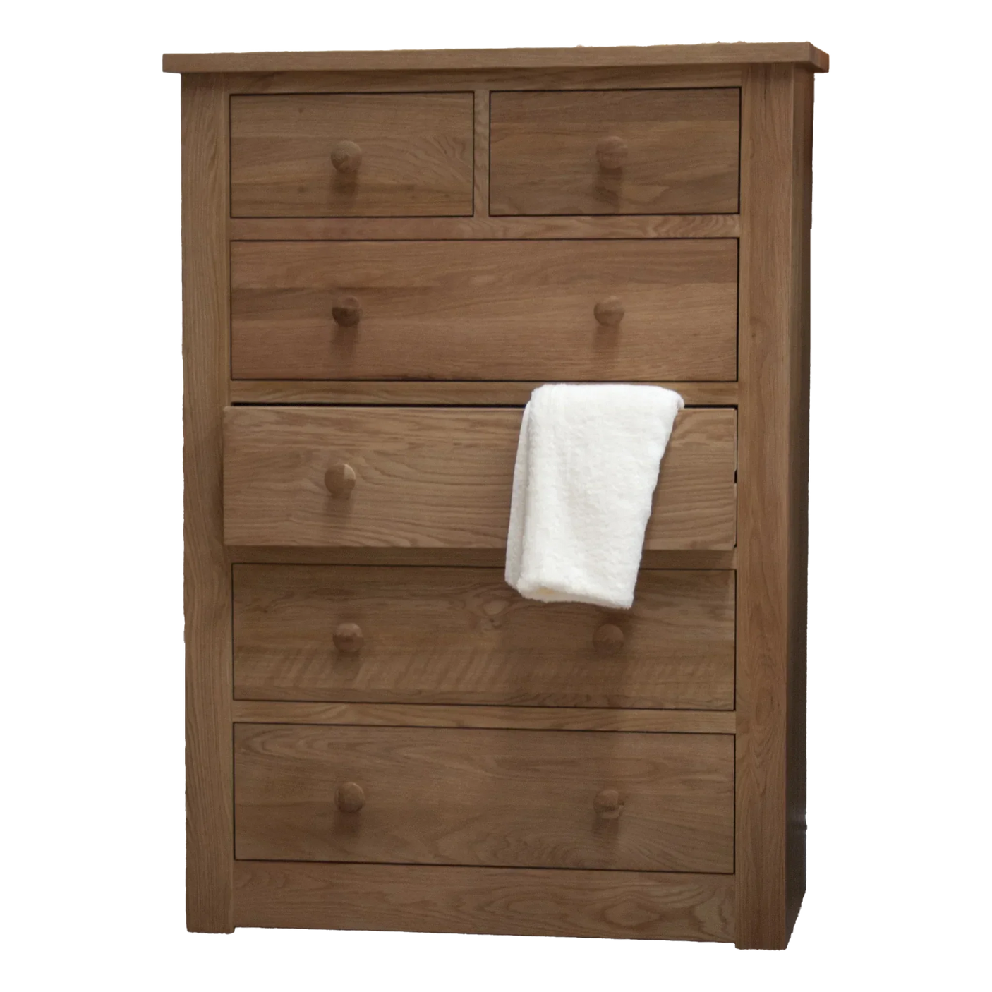 Oak chest of drawers with five large drawers and two small top drawers, white towel draped