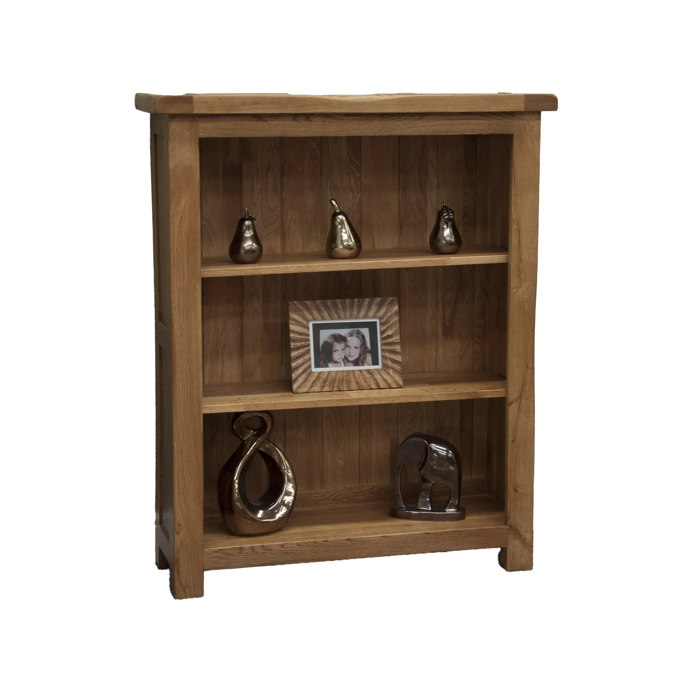 Oak bookcase with three shelves, displaying ornaments and photo frame, front view