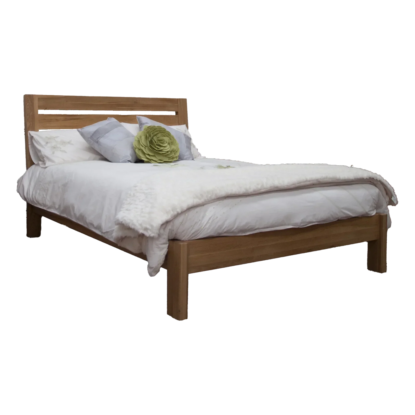 Oak wooden bed frame with white bedding and decorative pillows