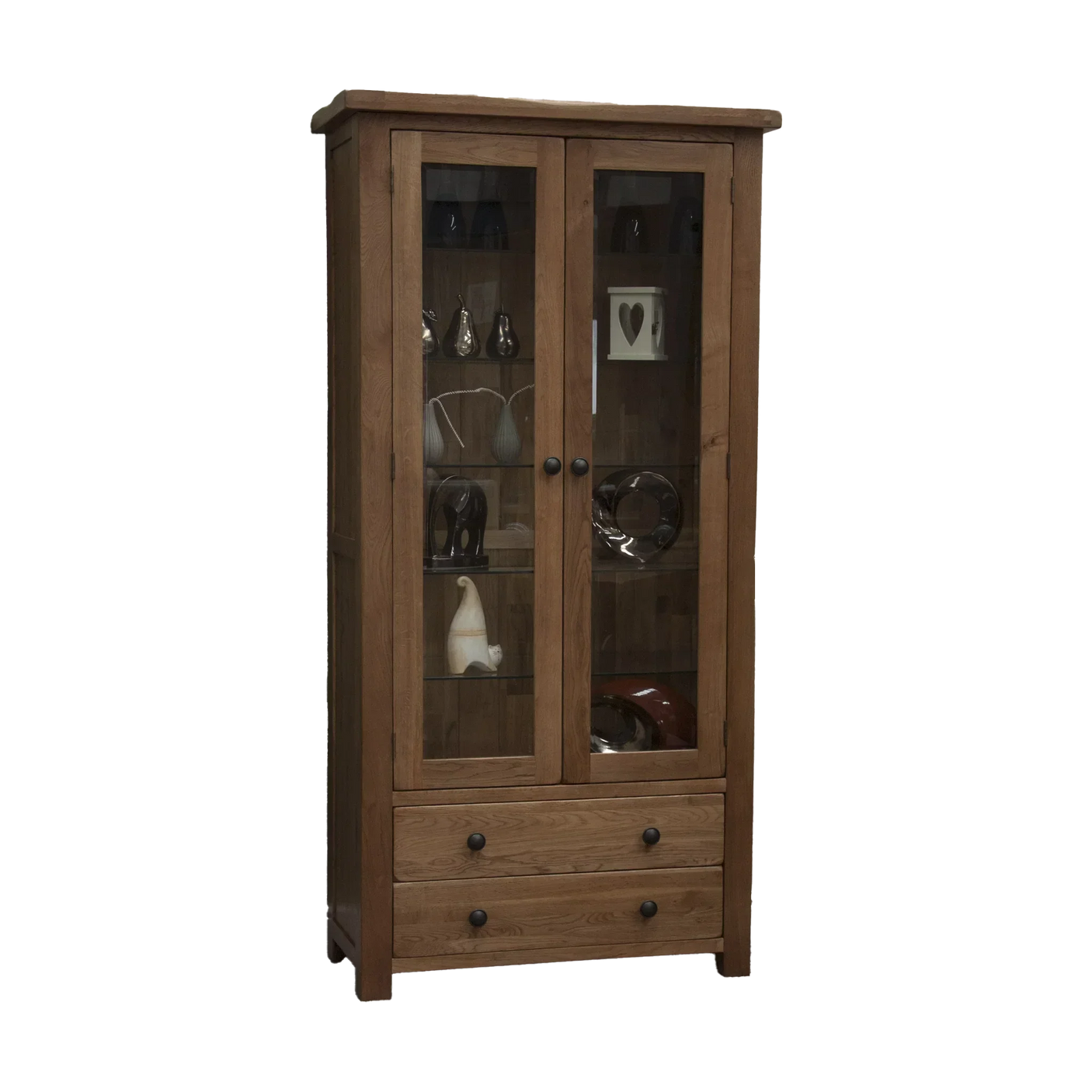 Oak display cabinet with glass doors, two drawers, and shelves holding decorative items