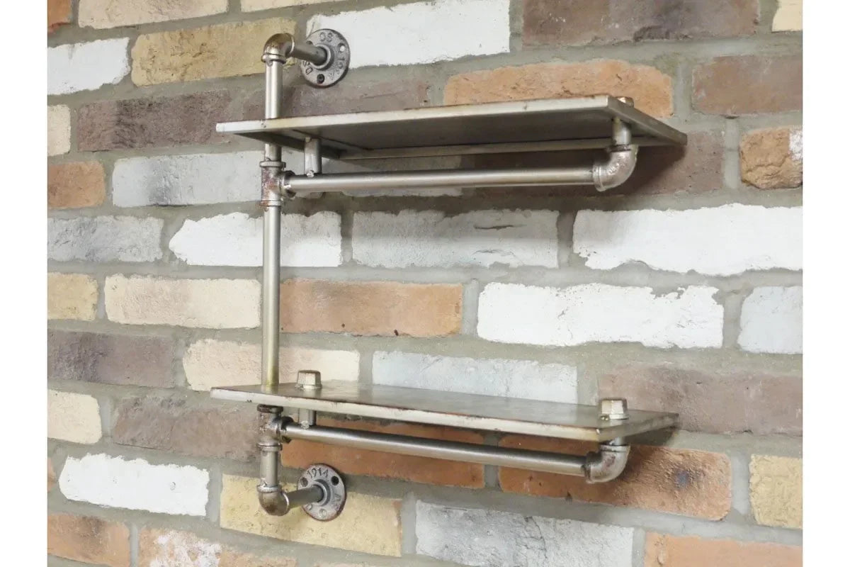 Industrial pipe wall shelves with metal finish mounted on brick wall