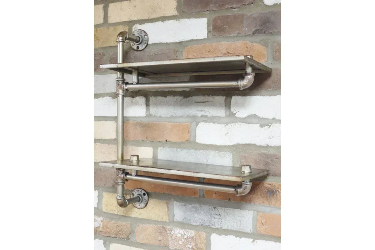 Industrial wall shelf with metal pipe frame and two tiers on exposed brick wall
