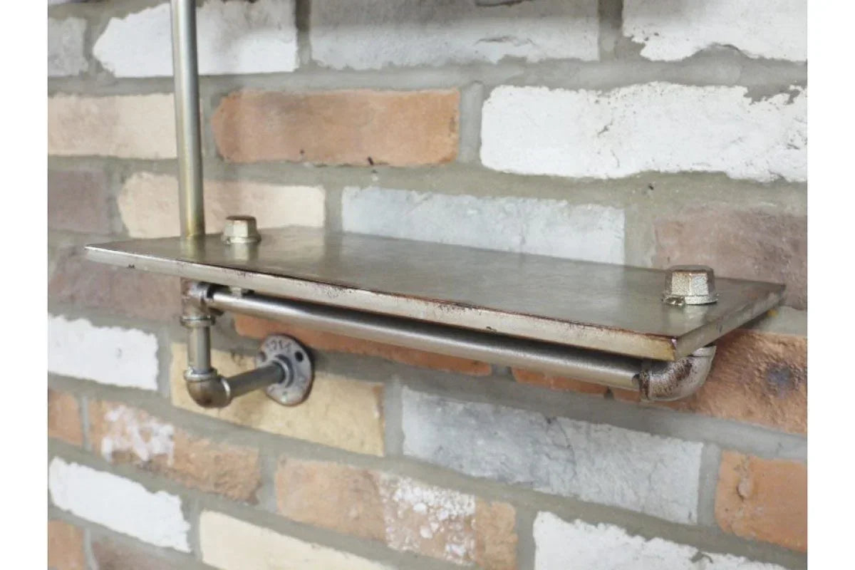 Industrial metal wall shelf with pipe design mounted on exposed brick wall