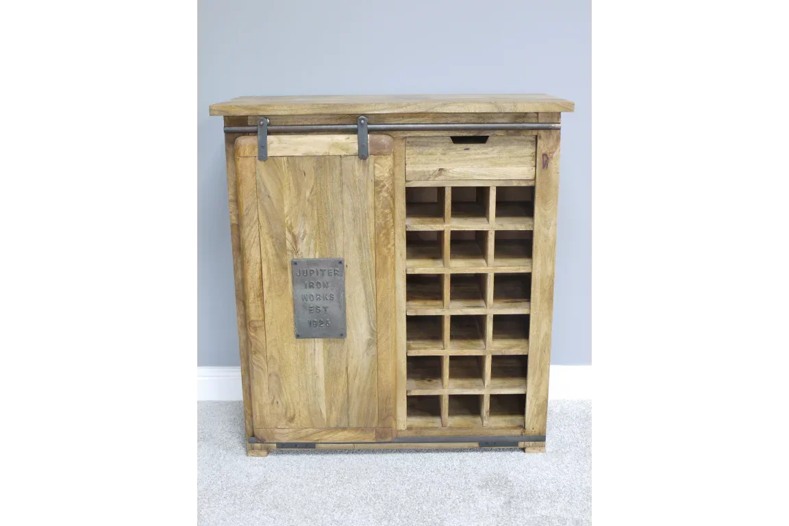 Rustic wooden wine cabinet with sliding door, metal plaque, and bottle storage shelves