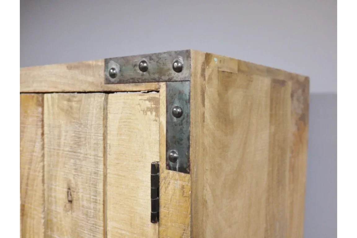 Closeup of wooden cabinet corner with metal brackets and visible grain detail