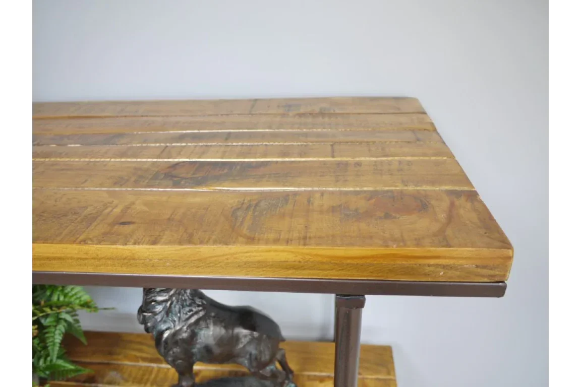 Closeup of wooden console table top with visible grain and metal frame