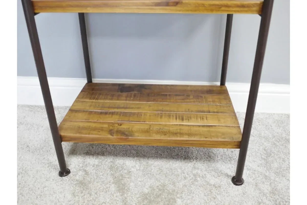 Wooden shelving unit with metal frame on light carpet, close-up of lower shelf