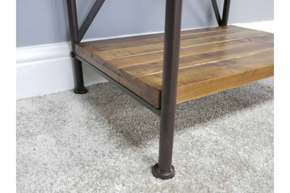 Industrial wooden shelf with metal frame legs on grey carpet