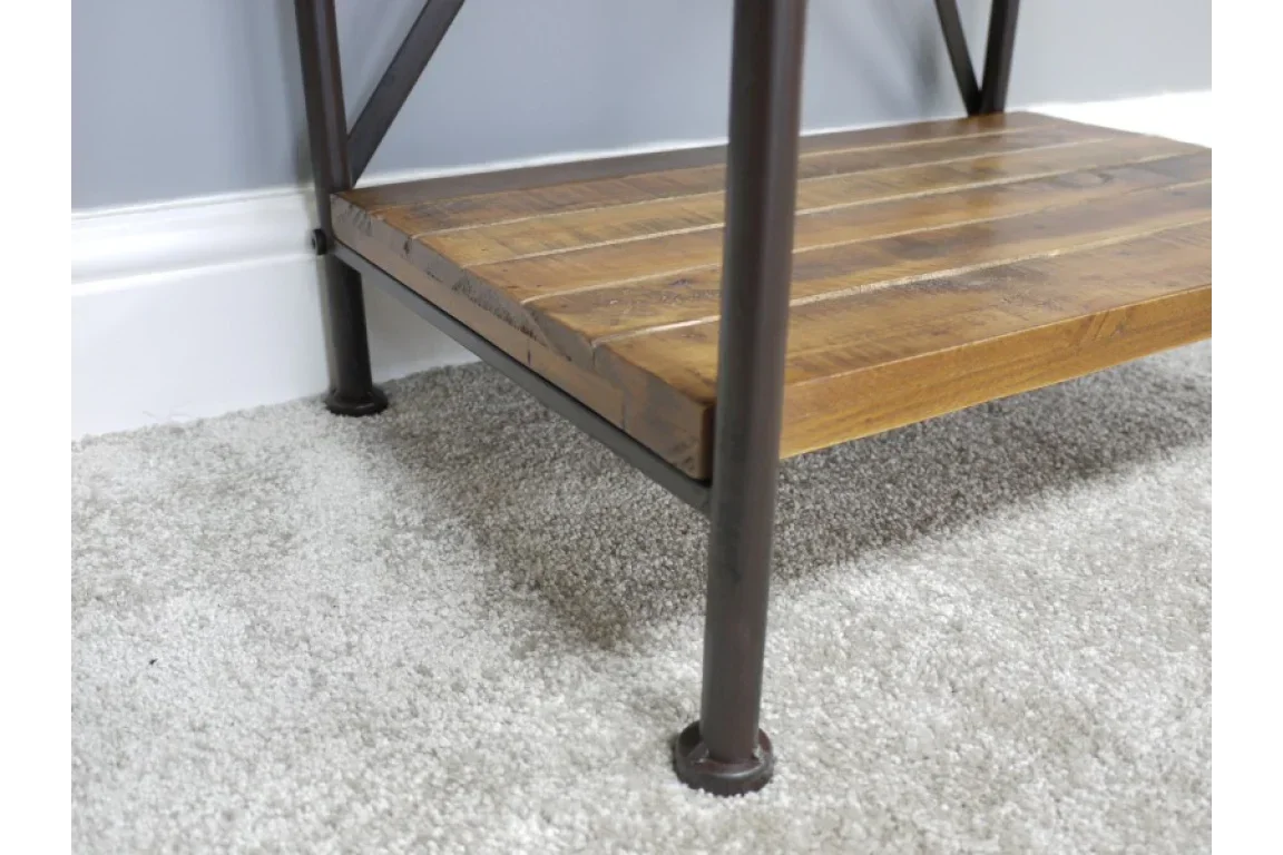 Close view of wooden shelf with metal frame legs on carpeted floor