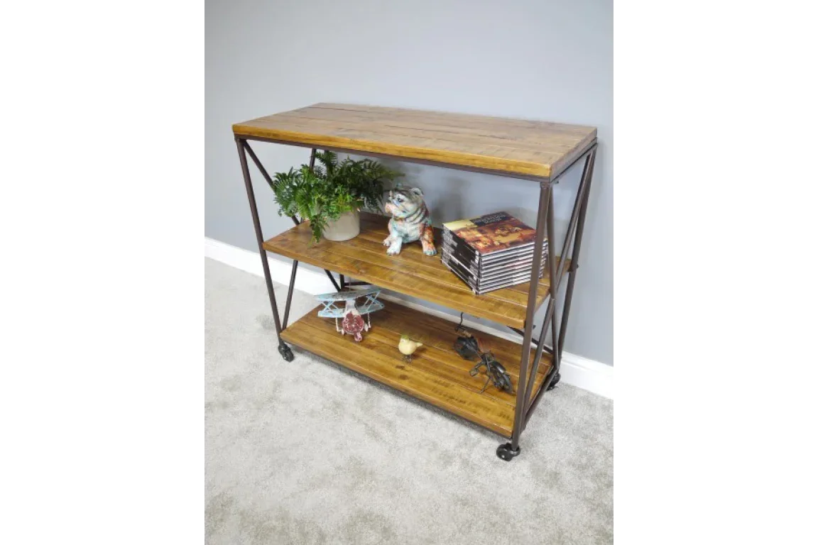 Industrial wood console table with metal frame, three shelves, decorative items and books