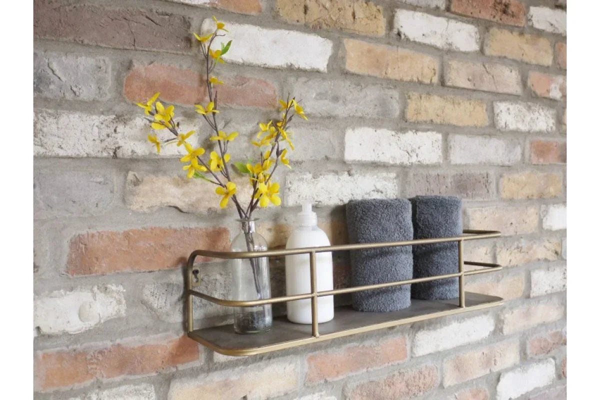 Wall mounted metal shelf with glass vase, yellow flowers, grey towels and lotion bottle