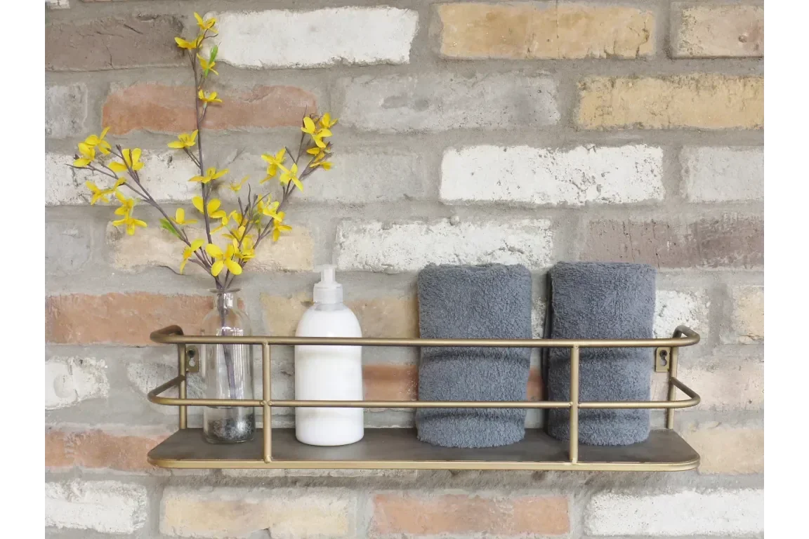 wall shelf with metal rail holding glass vase with yellow flowers, soap dispenser, grey towels