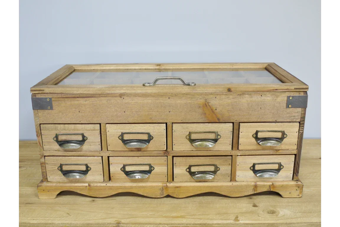 Rustic wooden storage chest with eight metal-handled drawers and glass display lid