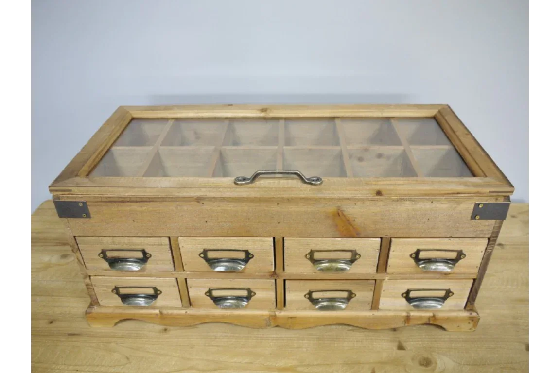 Wooden storage box with glass lid and nine labelled drawers on wooden table