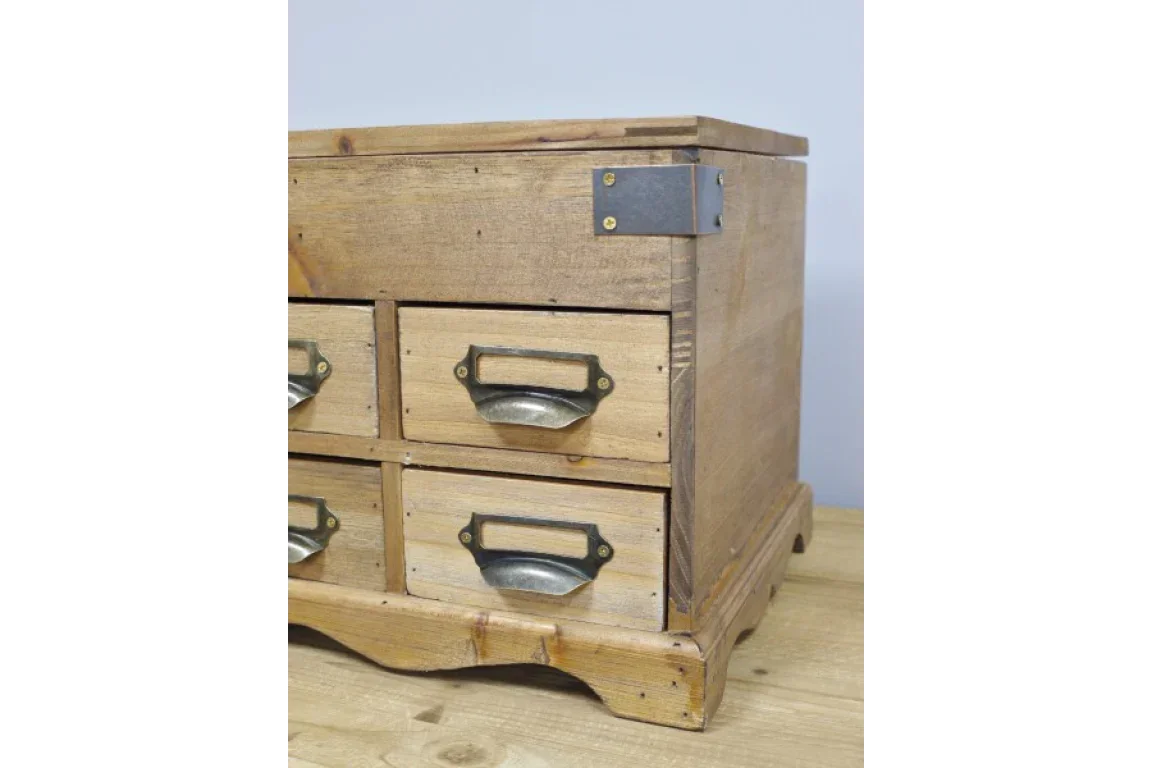 Rustic wooden storage chest with four drawers and metal handles, side angle view
