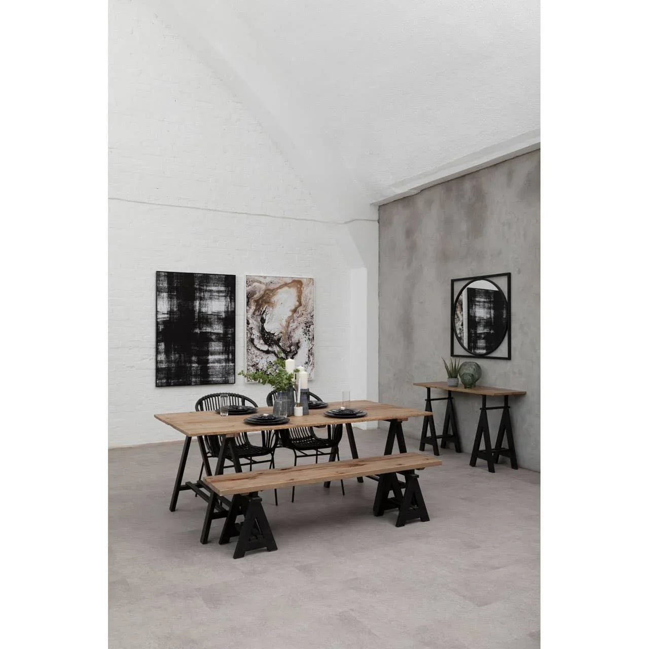 Industrial dining table set with benches and black chairs in modern loft dining room